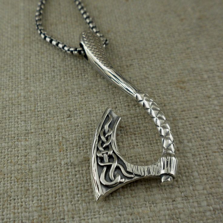 "Sterling Silver with Bronze accents Viking Axe Pendant with Celtic Design. Double-sided with lightly oxidized background. Size: 1 3/4\" Long x 3/4\" Wide 16.2 grams. 22\" Venetian Box Chain with Lobster Clasp (Can substitute 16\", 18\" or 20\") Petrichor Viking Thor's Hammer Pendant by Keith Jack Imported from Canada Stamped & Signed by the Artist In Stock! Ships Immediately. Gift Boxed with cleaning cloth." Hand Forged Silver Viking Jewelry, Viking Style Engraved Sterling Silver Jewelry, Celtic Viking, Thor's Hammer, Celtic Design, Celtic Designs, Box Chain, Cleaning Cloth, Lobster Clasp