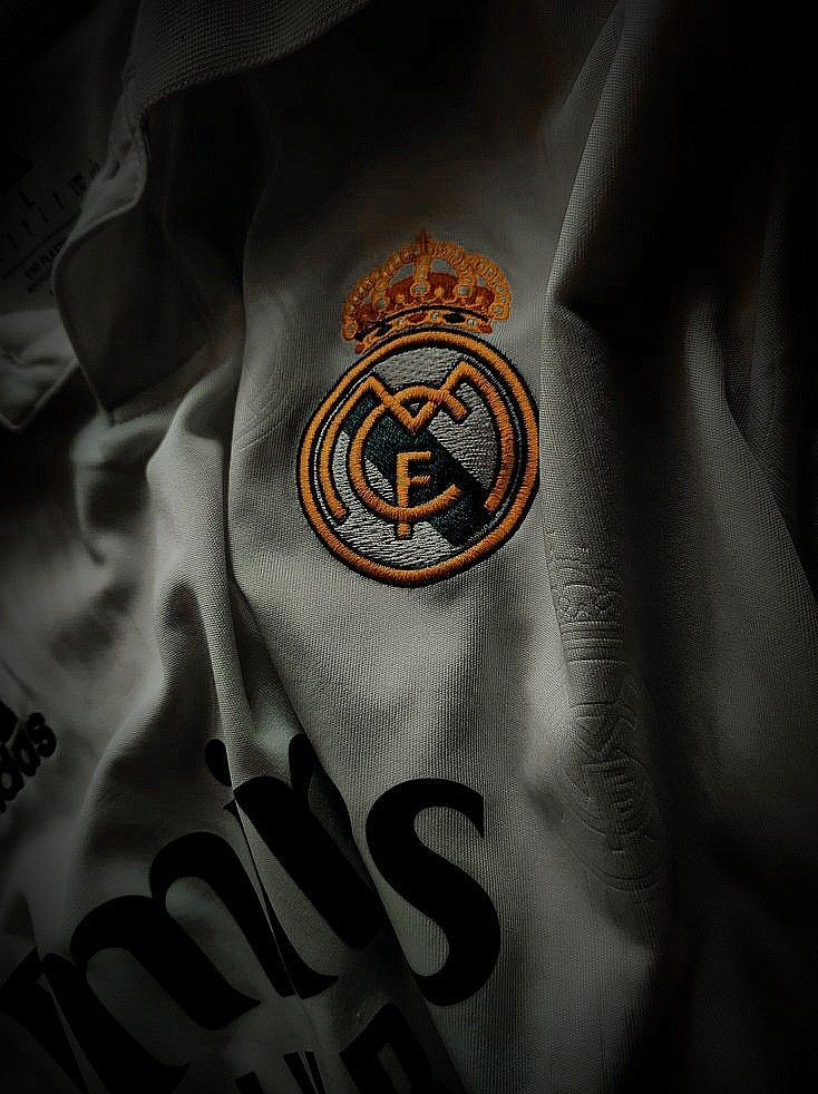 the real madrid jersey is shown in black and white