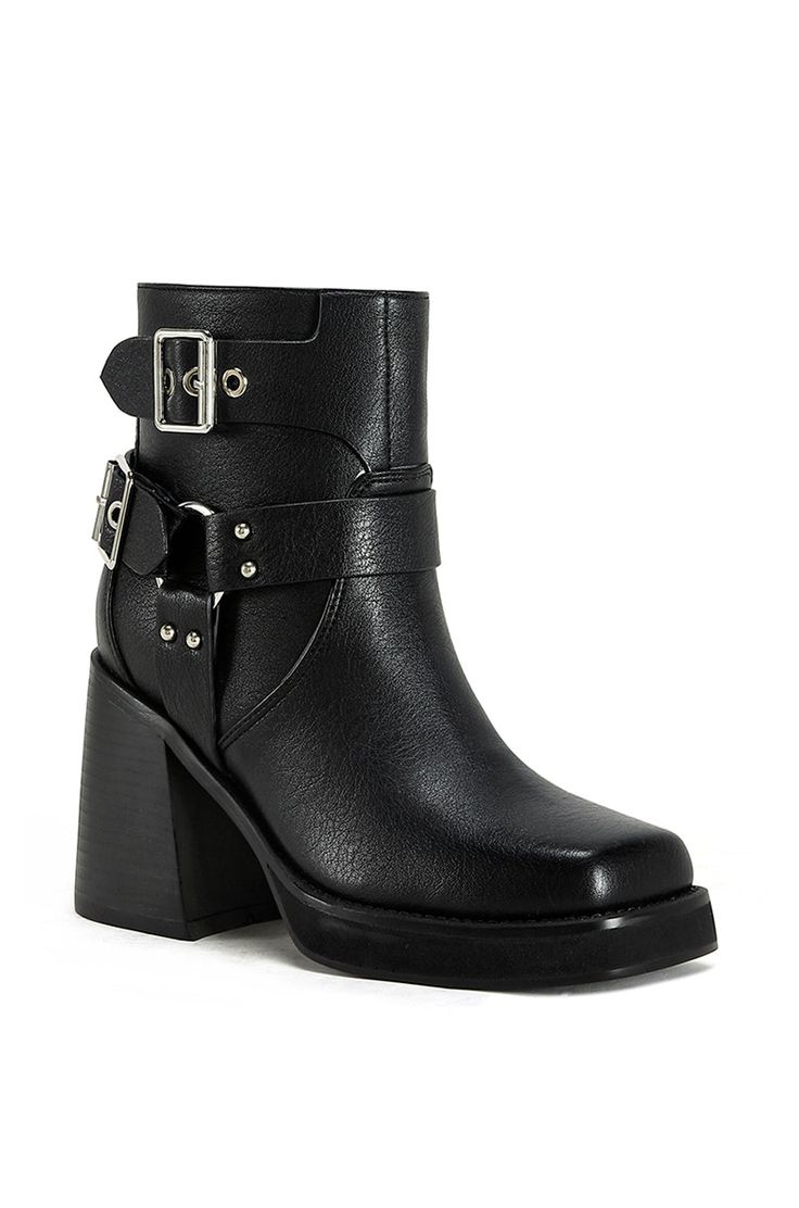 These black faux leather biker booties feature a block heel for added height and a touch of edginess. Complete with silver belt buckle hardware details on the shaft, these boots are perfect for adding a touch of moto-inspired style to any outfit. Edgy Heeled Boots With Buckle In Faux Leather, Punk Moto Boots With Buckle For Fall, Punk Moto Boots With Buckle Closure For Fall, Black Square Toe Moto Boots For Fall, Black Punk Heeled Boots With Buckle Closure, Punk Style Moto Boots With Buckle For Fall, Edgy Black Moto Boots With Chunky Platform, Edgy Chunky Platform Boots With Square Toe, Black Edgy Platform Boots With Buckle Closure