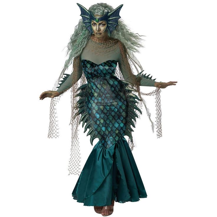 a woman dressed as a mermaid with green hair and blue eyes is standing in front of a white background