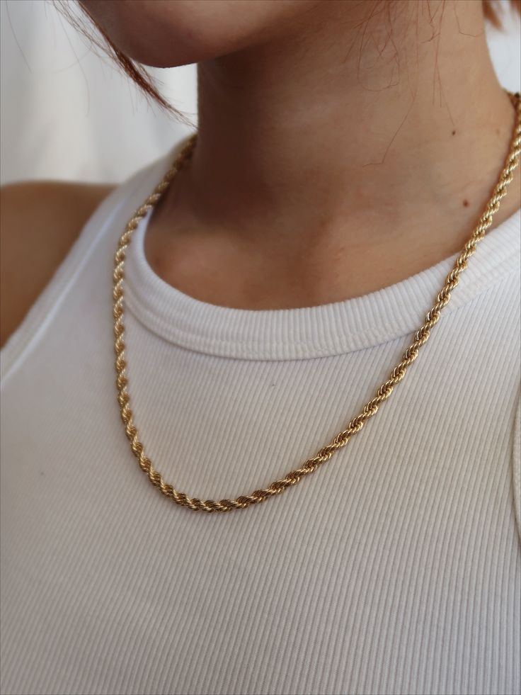 Our 18k Gold Filled Rope Chain Necklace is the perfect layering piece to accentuate any style. This lightweight rope chain pairs beautifully with other chain necklaces or pendants--We love it with our Anabella Necklace. This essential necklace is a must-have for every fashion lover! Details 18k Gold Filled 18in 20in, 22in in Length 2.5mm width model wearing 20in Tarnish-resistant, water-resistant, and safe for sensitive skin Minimalist Yellow Gold Rope Chain Necklace For Everyday, Everyday Minimalist Yellow Gold Rope Chain Necklace, Minimalist Everyday Rope Chain Jewelry, Everyday Minimalist Rope Chain Jewelry, Dainty Everyday Rope Chain Jewelry, Classic Rope Chain Necklaces As Gift, Classic Rope Chain Necklaces For Gifts, Classic Everyday Rope Chain Jewelry, Dainty Adjustable Rope Chain Necklace Gift