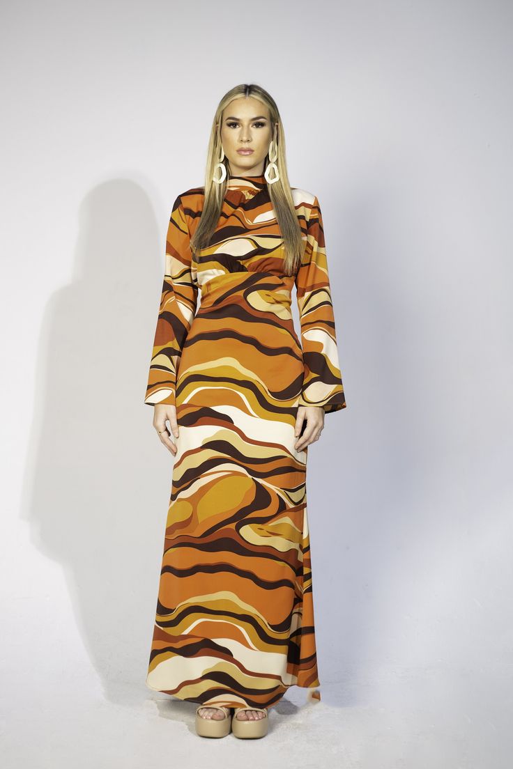 Multicolor Maxi Dress For Fall, Multicolor Printed Maxi Dress For Fall, Chic Multicolor Maxi Dress For Fall, Retro Multicolor Printed Maxi Dress, Multicolor Abstract Print Maxi Dress, Multicolor Maxi Dress For Fall Party, Flowy Brown Printed Maxi Dress, Fitted Maxi Dress With Abstract Print, Multicolor Long Sleeve 70s Inspired Dress