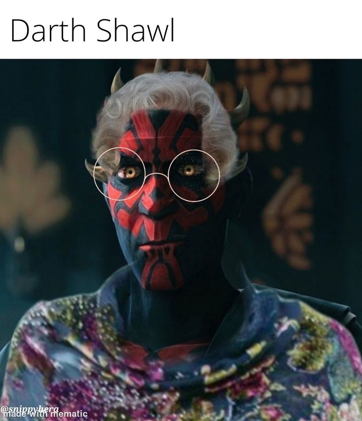 a man with red and black paint on his face, wearing glasses that read darth shawl