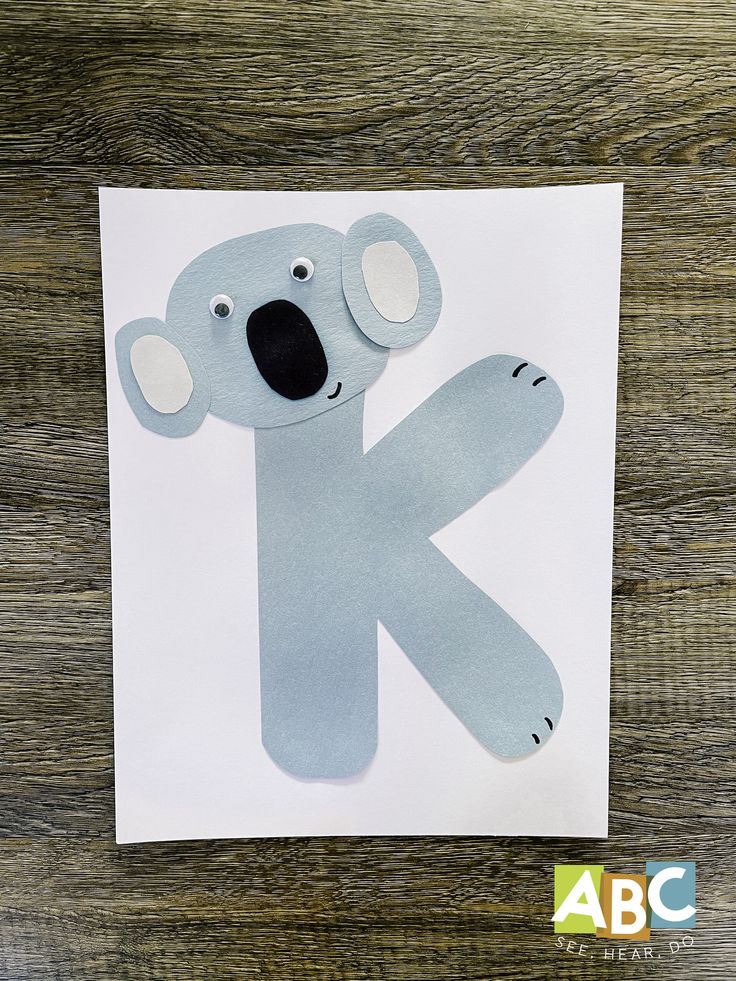 a paper cut out of a koala with the letter k