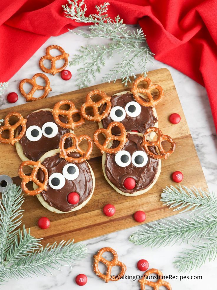 reindeer pretzels with chocolate frosting on a cutting board