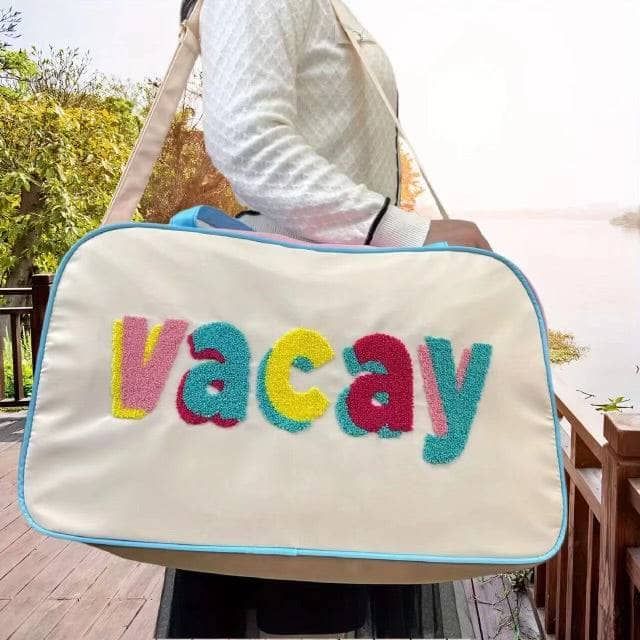 Description: Get ready for your next adventure with the VACAY Travel Bag. Features a vibrant and playful design with the word "VACAY" in colorful letters. Spacious interior, perfect for packing all your travel essentials. 9”W x 12”H x 20.5”L Material & Care: Fabric: Durable and lightweight polyester blend. Care Instructions: Wipe clean with a damp cloth. Do not bleach. Handle with care to maintain the vibrant colors. Playful Rectangular Travel Luggage, Playful Rectangular Luggage For Travel, Playful Multicolor Shoulder Bag For Travel, Multicolor Large Capacity Luggage For Trips, Large Capacity Multicolor Travel Bag, Large Capacity Multicolor Luggage For Trips, Retro Travel Shoulder Bag With Letter Print, Retro Shoulder Bag With Letter Print For Travel, Playful Multicolor Travel Luggage