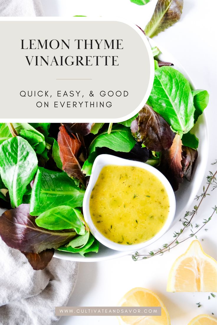 a bowl filled with lemon thyme vinaigrette next to sliced lemons