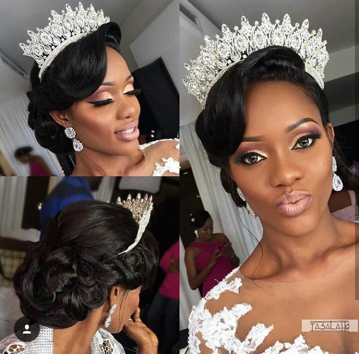 a woman wearing a tiara and posing for the camera in front of other women