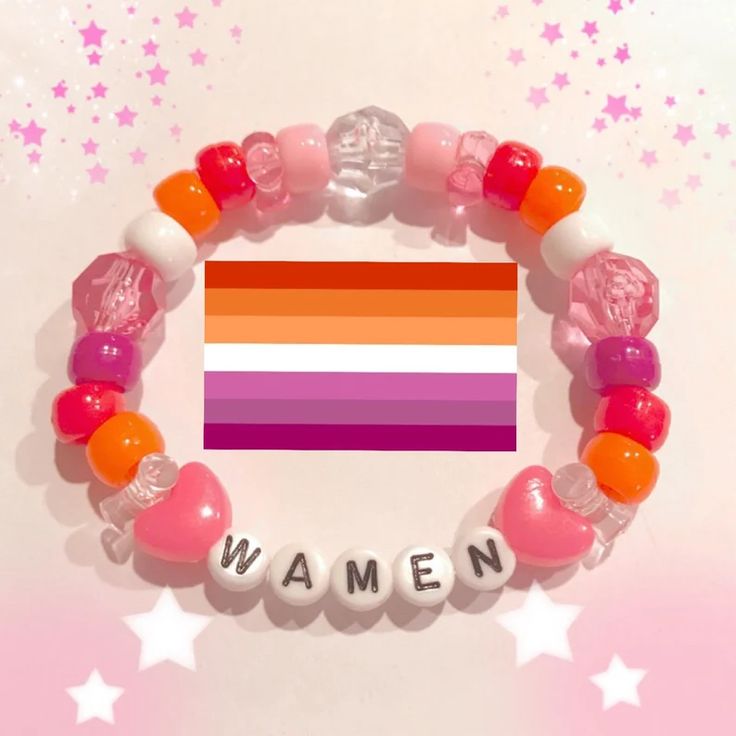 a bracelet with the word women spelled out in white letters and pink, orange, and purple beads