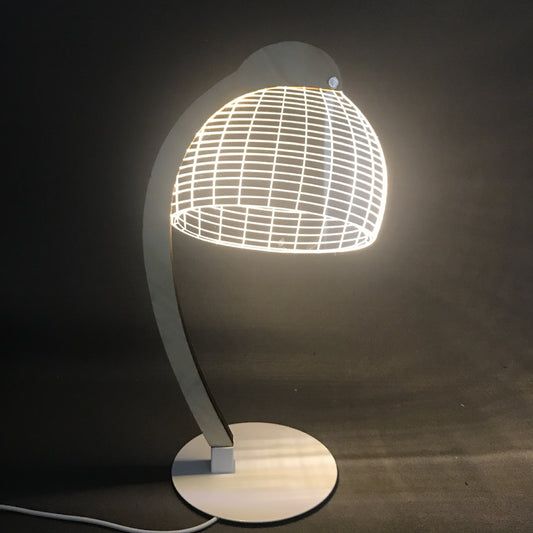 a lamp that is sitting on top of a table next to a black wall and floor