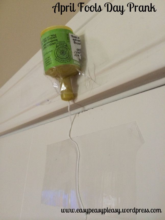 a can of paint is attached to the wall