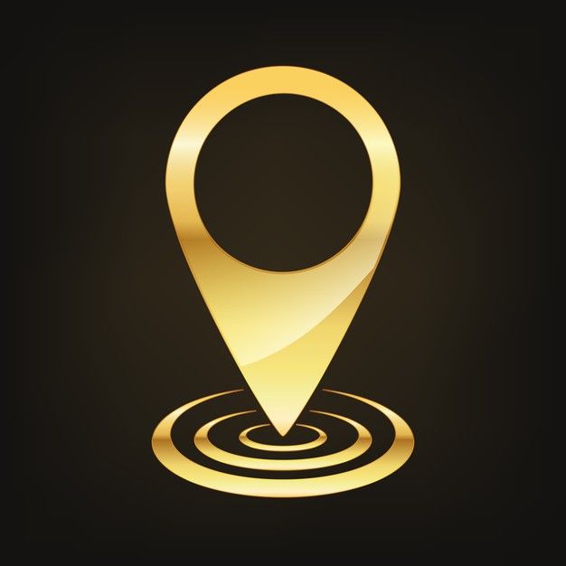 a gold pin on a black background with an image of a circle in the middle