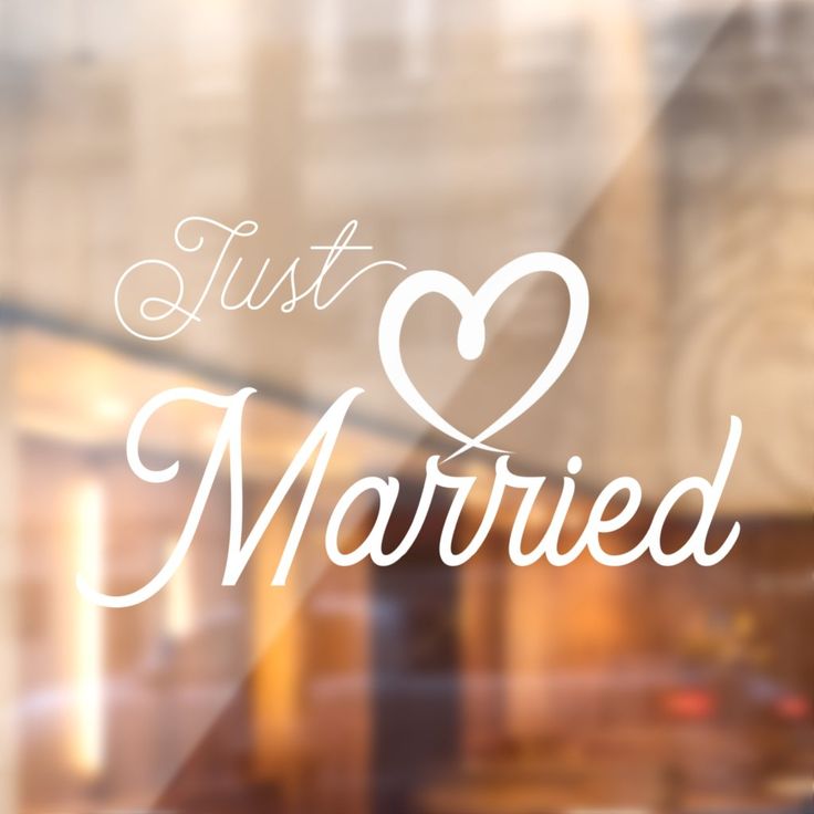 the words just married written in white on a window