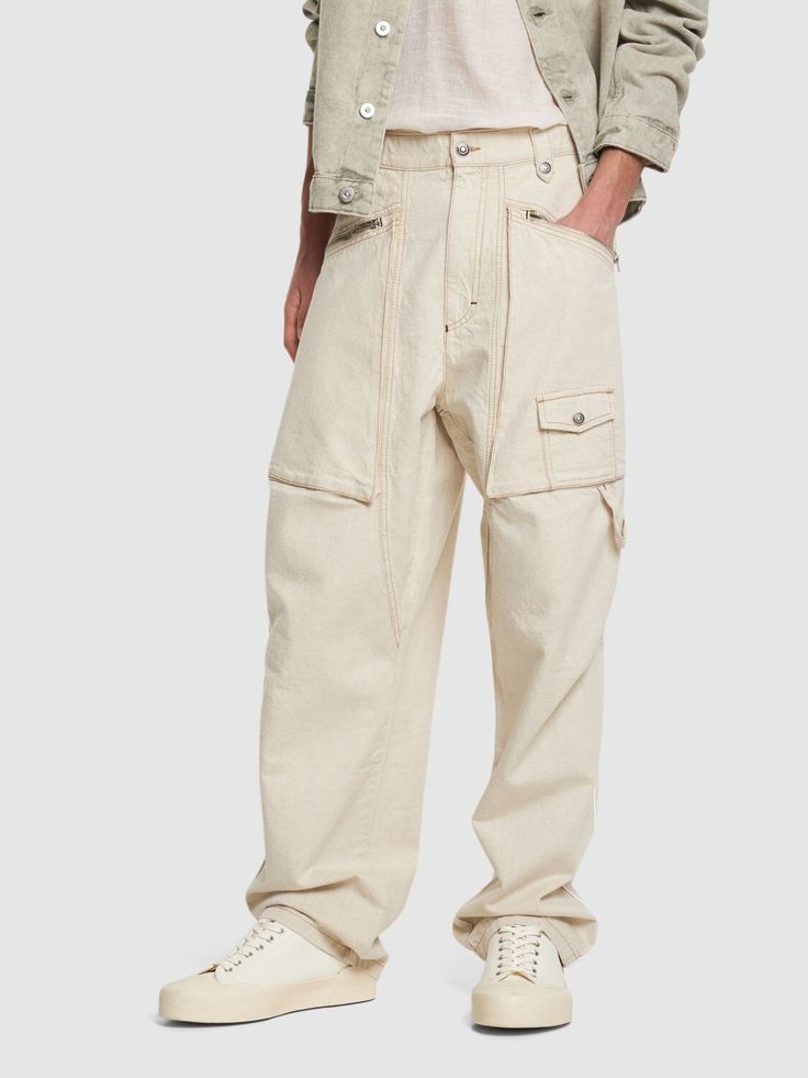 Front button and concealed zip closure. Two side pockets. One leg cargo pocket. Two back pockets. Model is wearing a size48 Relaxed Fit Cargo Trousers With Multiple Pockets, Relaxed Fit Tapered Leg Cargo Pants With Pockets, Urban Style Pants With Flap Pockets For Work, Urban Style Workwear Pants With Flap Pockets, Utility Bottoms With Multiple Pockets, Baggy Full-length Cargo Pants With Patch Pockets, Baggy Cargo Jeans With Straight Leg, Relaxed Fit Bottoms With Flap Pockets, Utility Bottoms With Side Pockets