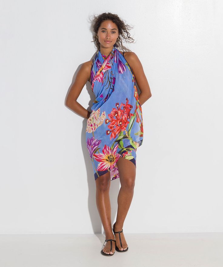 Go beyond the beach with this investment-worthy style in a stunning botanic print and elevated fabric that drapes beautifully! A sarong scarf (also known as a pareo) is a classic summer cover-up that is the epitome of versatility. Worn casual or chic, this beach-ready essential can be a dress, a skirt, or a scarf. Dimensions: 42" x 70" Materials: 80% cotton / 20% silk Made in: India ​ Bohemian Tropical Print Sarong For Pool, Bohemian Sarong With Tropical Print For Pool, Summer Floral Print Sarong For Poolside, Summer Floral Print Sarong Beachwear, Beachy Floral Print Sarong For Summer, Tropical Sarong For Poolside Spring, Hawaiian Sarong For Spring Poolside, Hawaiian Style Sarong For Spring Poolside, Elegant Summer Beach Scarves