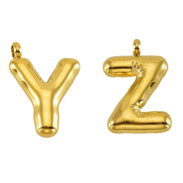 two gold earrings with the letter z in it's upper and lowercases