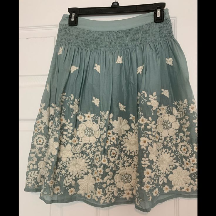 Beautiful Embroidery Skirt With Zipper On The Side. Very Beautiful Details And 60% Silk And 40% Cotton Embroidered Skirted Bottoms For Spring, Relaxed Floral Embroidery Skirt For Spring, Blue Floral Embroidery Skirt For Spring, Spring Embroidered Skirted Bottoms, Embroidered Midi Skirt For Summer, Casual Embroidered Relaxed Fit Skirt, Casual Embroidered Tiered Skirt, Blue Skirt With Floral Embroidery For Summer, Casual Embroidered Skirt For Spring