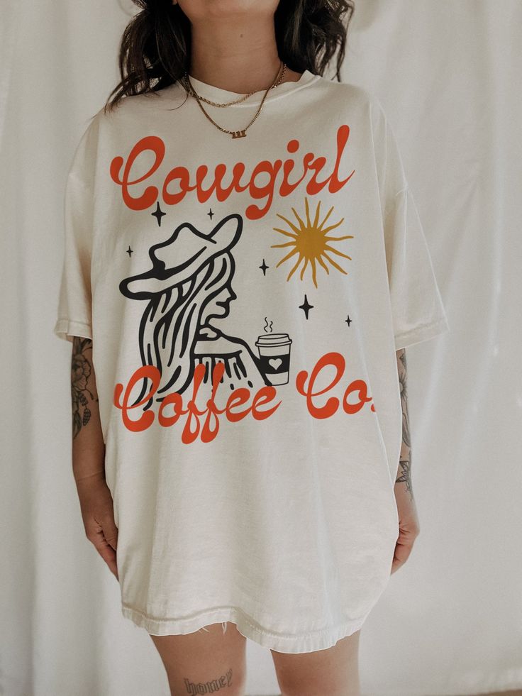 Cowgirl Coffee Co Tee – We The Babes Casual Coffee-colored Screen Print T-shirt, Comfortable Graphic Print T-shirt, Coffee Color Short Sleeve T-shirt With Screen Print, Comfortable Graphic Print T-shirt For Streetwear, Casual Comfortable Fit T-shirt With Graphic Print, Oversized Soft-washed T-shirt For Loungewear, Retro Everyday Short Sleeve T-shirt, Coffee Colored Crew Neck T-shirt For Everyday, Oversized Retro Cotton T-shirt