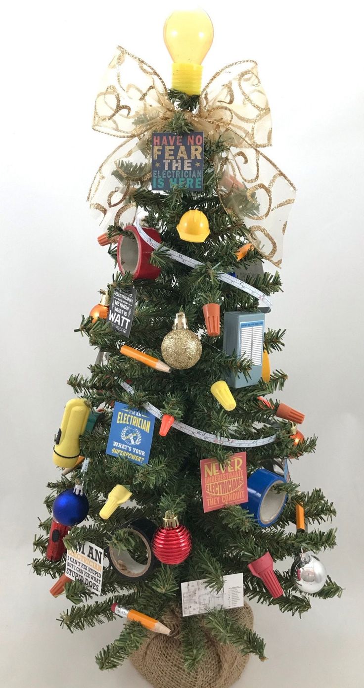 a small christmas tree with various items on it