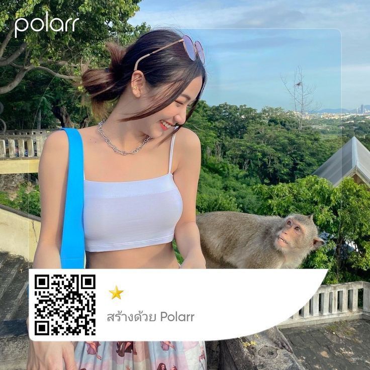 a woman standing on top of a roof next to a monkey