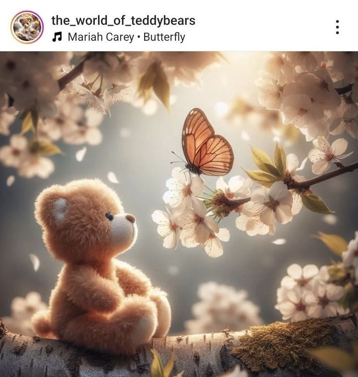 a teddy bear sitting on top of a tree branch with a butterfly flying over it