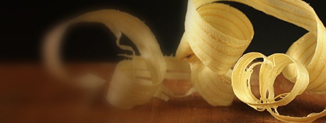 two peeled bananas sitting on top of a wooden table