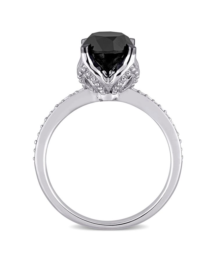 a black and white diamond engagement ring on a white background with diamonds around the band