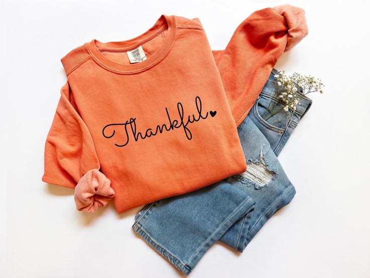 Are you looking a Thankful Sweatshirt? We've got you! ABOUT OUR Womens Thanksgiving Comfort Colors® shirt *80% ring-spun cotton, 20% polyester *Medium-heavy fabric  *Relaxed fit *Sewn in twill label *OEKO-TEX certified low-impact dyes HOW TO ORDER your Thanksgiving Family Shirt 1. Check our photos for sizing and color options.  2. Choose your quantity. Feel free to add as many shirts as you wish!  3. Select your size and color from the drop-down menus.  4. Click "ADD TO CART" to add the shirt to your virtual cart.  5. Click "PROCEED TO CHECKOUT" to purchase your shirt.  6. Your shirt is now off to production! We will process your order and your shirt will be ready for shipment in 1-4 days!  SIZE ▸ Take a look at the photos to see a specific sizing chart for this t-shirt style ▸ Please note Thankful Sweatshirt, Spooky Sweatshirt, Cozy Halloween, Hey Boo, Cowl Neck Sweatshirt, Thanksgiving Family, Target Clothes, Sweatshirt Halloween, Halloween Spider