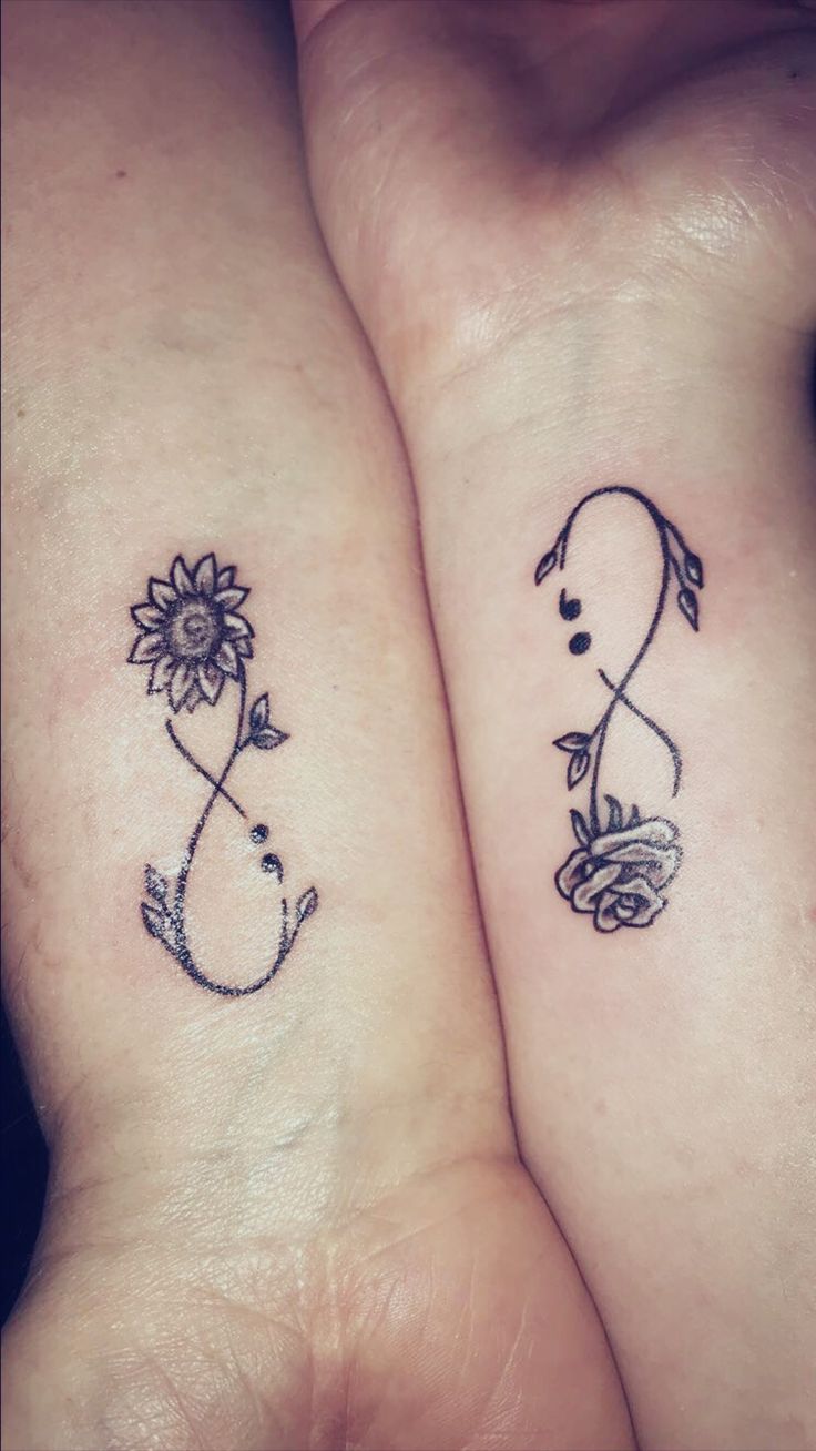 two small tattoos on their arms that are both cute and curvy, one has a sunflower