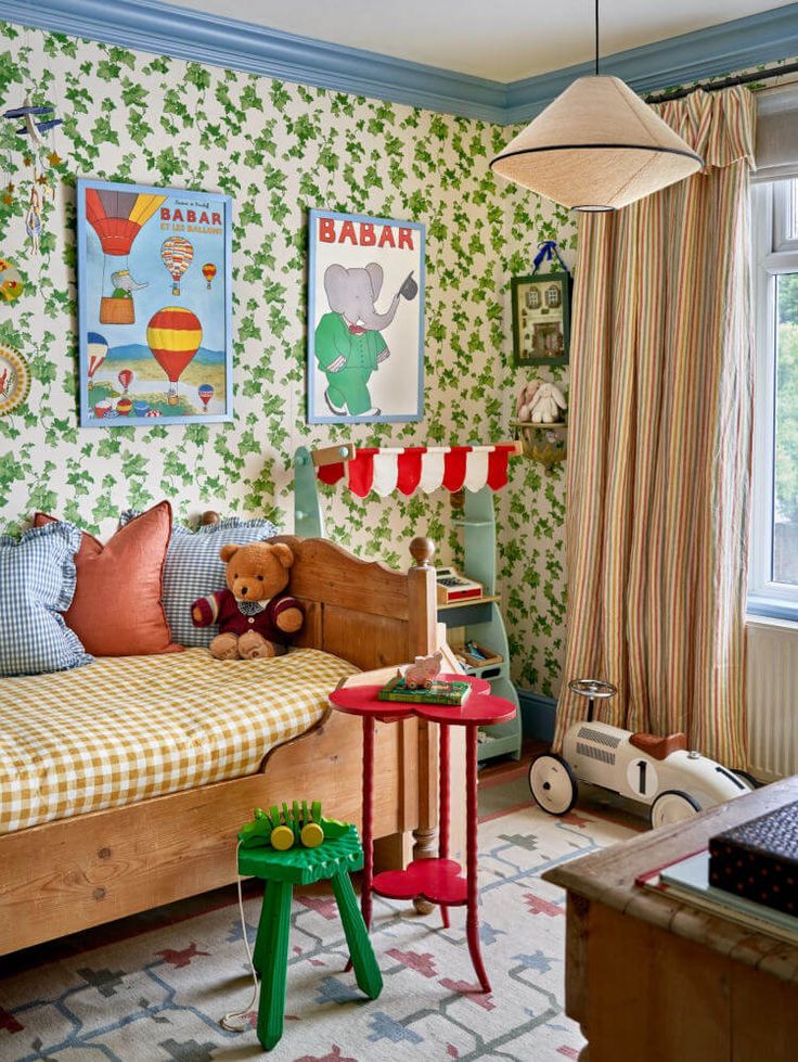 a child's bedroom decorated in green, red and yellow with toys on the floor