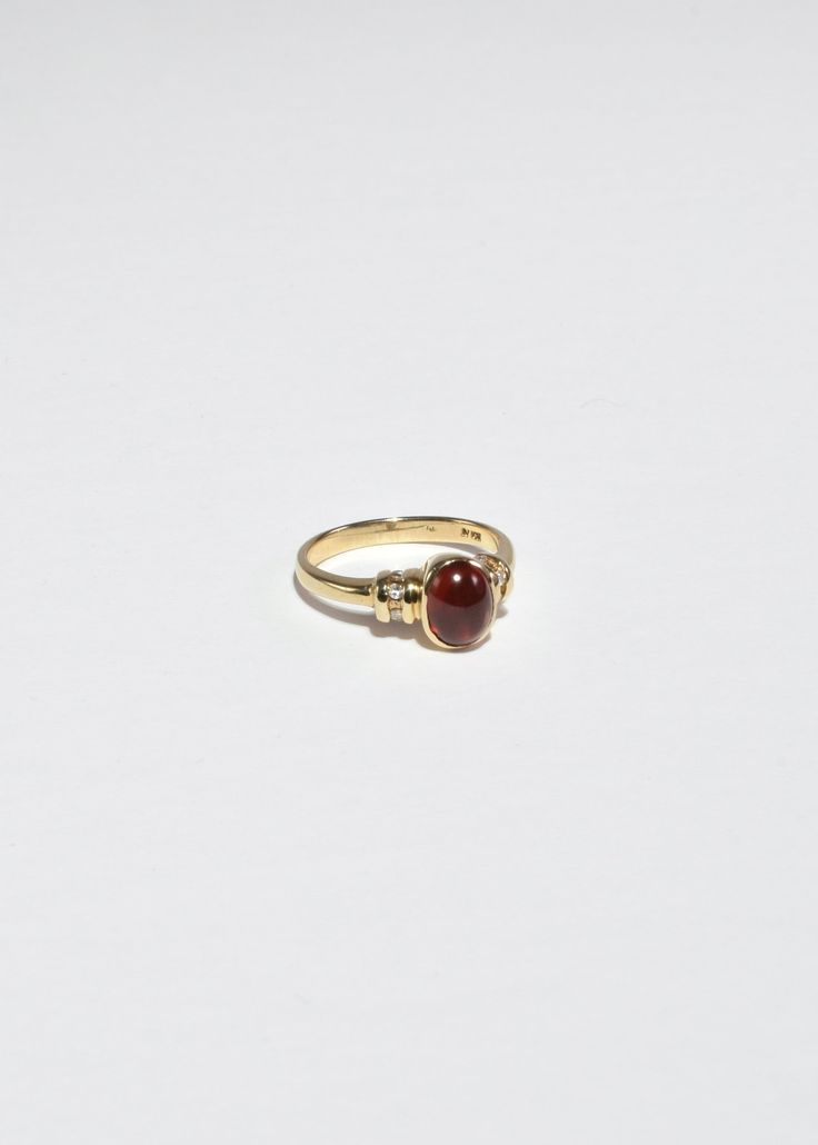 Beautiful vintage gold ring with a polished ruby cabochon and diamond detail. Stamped 10k. Material: 10k gold, ruby, diamond. We recommend storing in a dry place and periodic polishing with a cloth. Gold Oval Cabochon Diamond Ring With Gemstone, Gold Diamond Ring With Oval Cabochon Gemstone, Yellow Gold Ruby Signet Ring With Polished Finish, Oval Cabochon Ruby And Diamond Ring, Heirloom Yellow Gold Diamond Ring With Oval Cabochon, 14k Gold Oval Cabochon Gemstone Dome Ring, Red Ruby Oval Cabochon Ring In 14k Gold, 14k Gold Dome Ring With Oval Cabochon Gemstone, Oval Cabochon Red Ruby Ring In 14k Gold