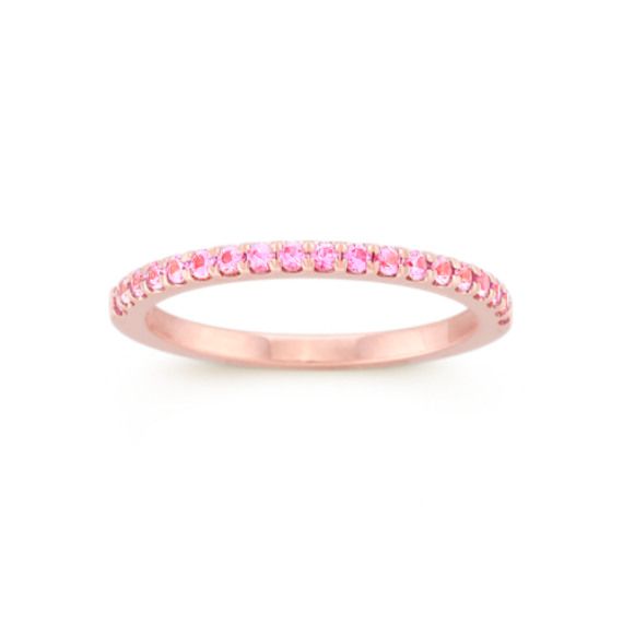 Full of vibrant color  this natural pink sapphire band is beautiful next to an engagement ring or all on its own. Crafted in romantic 14-karat rose gold  the gemstones are hand-selected for consistent beauty. Pink Sapphire Stackable Ring For Anniversary, Pink Eternity Band With Prong Setting As Promise Ring, Pink Sapphire Stackable Ring In Fine Jewelry Style, Pink Gold Pink Sapphire Ring With Halo Setting, Fine Jewelry Pink Gold Diamond Ring With Pink Sapphire, Elegant Pink Sapphire Stackable Ring, Fine Jewelry Pink Sapphire Diamond Ring In Pink Gold, Pink Eternity Band With Prong Setting, Pink Diamond Ring With Round Band