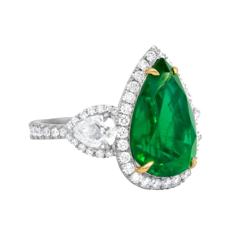 Platinum and 18kt Yellow Gold Emerald Diamond Ring: Centered with an 8.78ct pear-shaped green emerald Accented by 2 pear-shaped GIA certified diamonds (ID: 1215069844) on the side Surrounded by 2.00cts of micropave round diamonds Size: 6 Edwardian Engagement Ring, Emerald Ring Vintage, Diamond Rings With Price, Platinum Diamond Rings, Antique Diamond Rings, Emerald Diamond Ring, Vintage Style Rings, Vintage Diamond Rings, Diamond Cocktail Rings