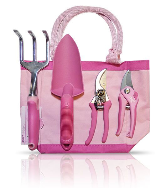 a pink bag with tools in it sitting on top of a white table next to a pair of scissors