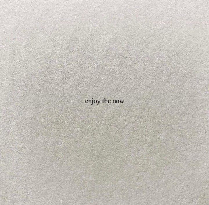 an empty piece of paper with the words enjoy the now written in black on it