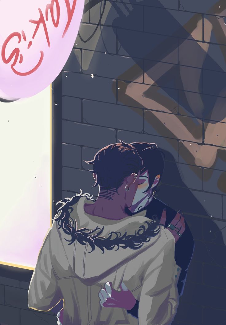 two people hugging each other in front of a brick wall with graffiti on the walls