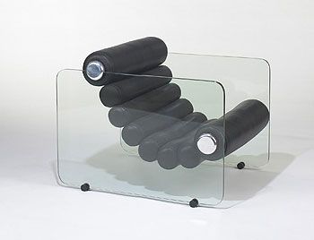 a glass table with some black objects on it