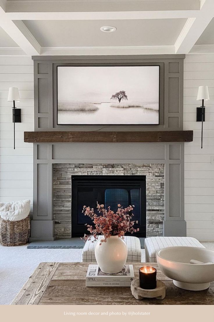 the living room is clean and ready for us to use it's fireplace as a focal point