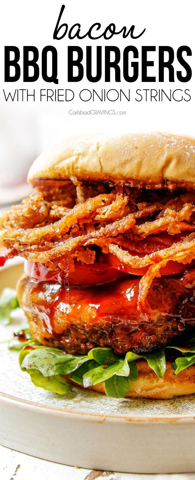 the bacon bbq burgers with fried onion strings are ready to be eaten and served