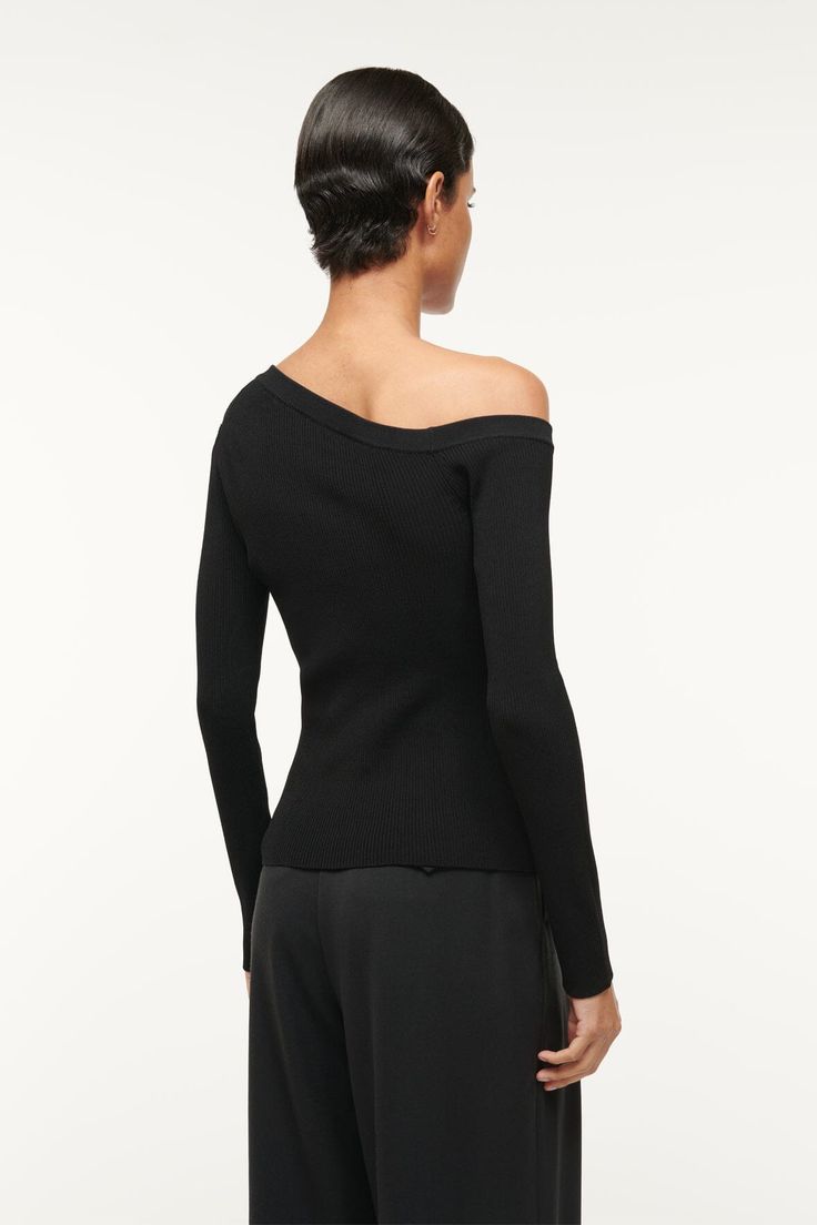 The Craftsman Sweater is our chic update to a classic fitted cardigan. This style is an off-one-shoulder button up cardigan. Formal Fine Knit Tops For Fall, Formal Off-shoulder Tops For Fall, Black Fitted Off-shoulder Sweater, Fitted Black Off-shoulder Sweater, Fitted Off-shoulder Black Sweater, Off-shoulder Tops For Fall Formal Occasions, Off-shoulder Tops For Formal Fall Occasions, Fitted Cardigan, Button Up Cardigan