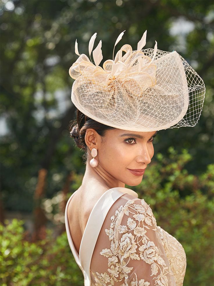 Lavetir is specialized in exquisite fascinators. We offer custom tailoring services to ensure each piece is uniquely yours. More details: Material: Tulle; Embellishment: Cap; Flower; Feather;  Shown in Burgundy color. Elegant Evening Bridal Accessories With Tulle, Elegant Evening Tulle Bridal Accessories, Elegant Tulle Bridal Accessories For Evening, Elegant Evening Bridal Accessories In Tulle, Elegant Fitted Tulle Bridal Accessories, Fitted Tulle Hats For Weddings, Elegant Tulle Mini Hats For Wedding, Elegant Evening Tulle Headpieces, Elegant Cream Headpieces For Wedding