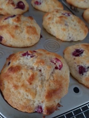 freshly baked muffins sitting in a pan on top of a stove burner