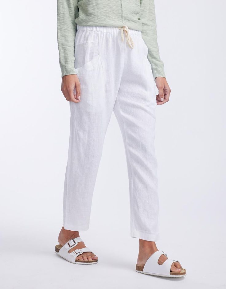 DESCRIPTION From holiday to everyday these ankle length Luxe Linen Pants from Little Lies are a summer necessity. With a comfortable elastic waist band with tie, front pockets and soft 100% linen, these pants pair perfectly with any top or lightweight knit for an effortlessly put together look. FEATURES & FIT Elastic waist band with tie Ankle length Slight drop crotch Front pockets Fit: Slim fit through the legs and waist. This style runs small, we recommend sizing up. Model is 171cm tall and is Summer Necessities, White Pants Women, Tropical Fashion, Body Bars, Swim Skirt, Swimwear Sale, Lightweight Knit, Everyday Wardrobe, Linen Pants