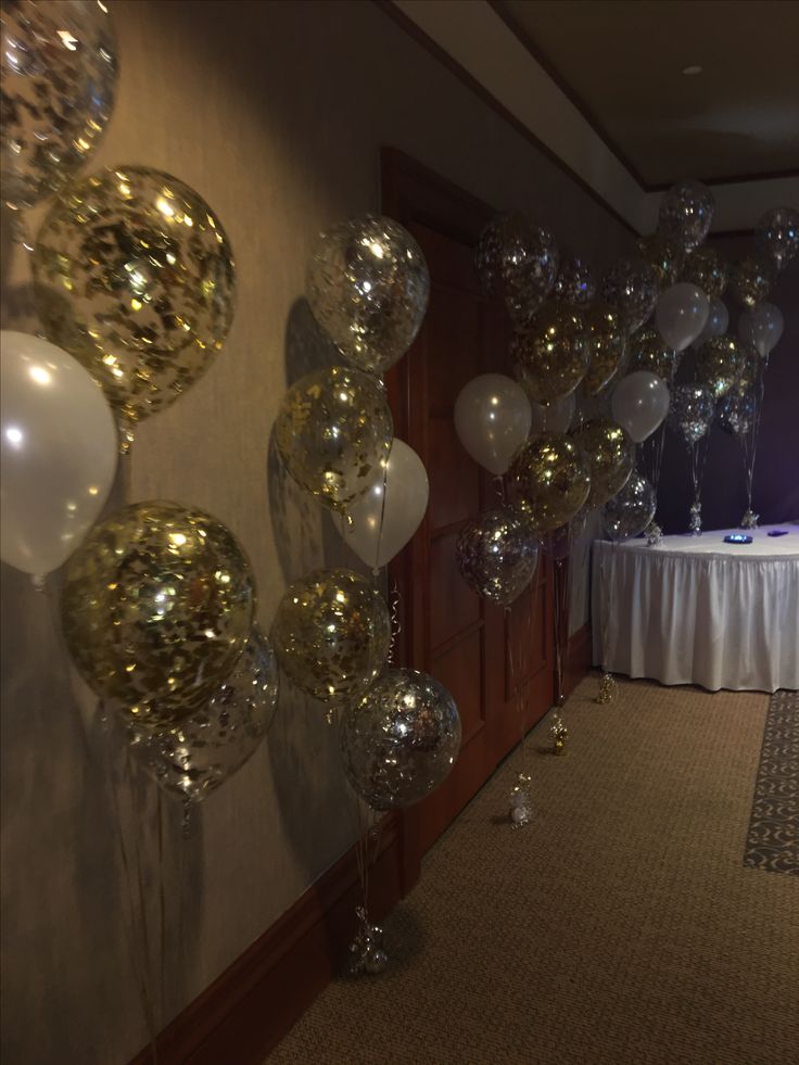 balloons and streamers are hanging from the ceiling