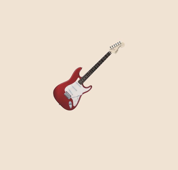 a red electric guitar is flying through the air