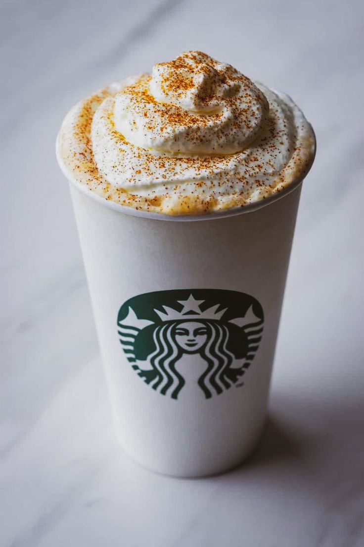 a starbucks drink with whipped cream on top