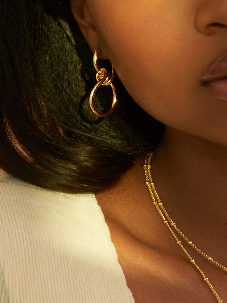 Is our favorite piece to stack with any of our necklaces. It is so simple and since it is doubled, it gives you two chains in one. We love pairing THE EMINA with chains like THE VICKY. or any other chain in our collection. Dimensions: inner layer 15” outer layer 18” Our jewelry is plated with 18k gold and brass. All our jewelry is made to last, but visit our care page for more information. Infinity Earrings, Bodysuit Tops, Stainless Steal, Double Chain, Brass Jewelry, Dainty Jewelry, The Chic, Simple Style, The Label