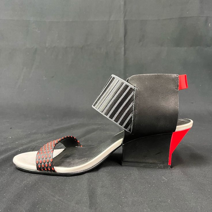 Beautiful Limited Edition Graphic Wedge Sandals With White And Red Detailing. Perfect For Events And Girls' Night Out. Great Condition. Lightly Worn. Light Discoloration On The Front Of The Sandal. Some Wear And Tear On The Sole Of The Sandals. Comes With A Box. Modern Wedge Sandals With Contrasting Heel, Modern Red Sandals With Heel Loop, Modern Red Sandals With Sculpted Heel, Black Sandals With Red Sole And Open Toe, Black Open Toe Sandals With Red Sole, Black Sandals With Red Sole And Ankle Strap, Modern Sandals With Red Sole For Evening, Modern High Heel Wedge Sandals With Wrapped Heel, Modern Evening Sandals With Red Sole