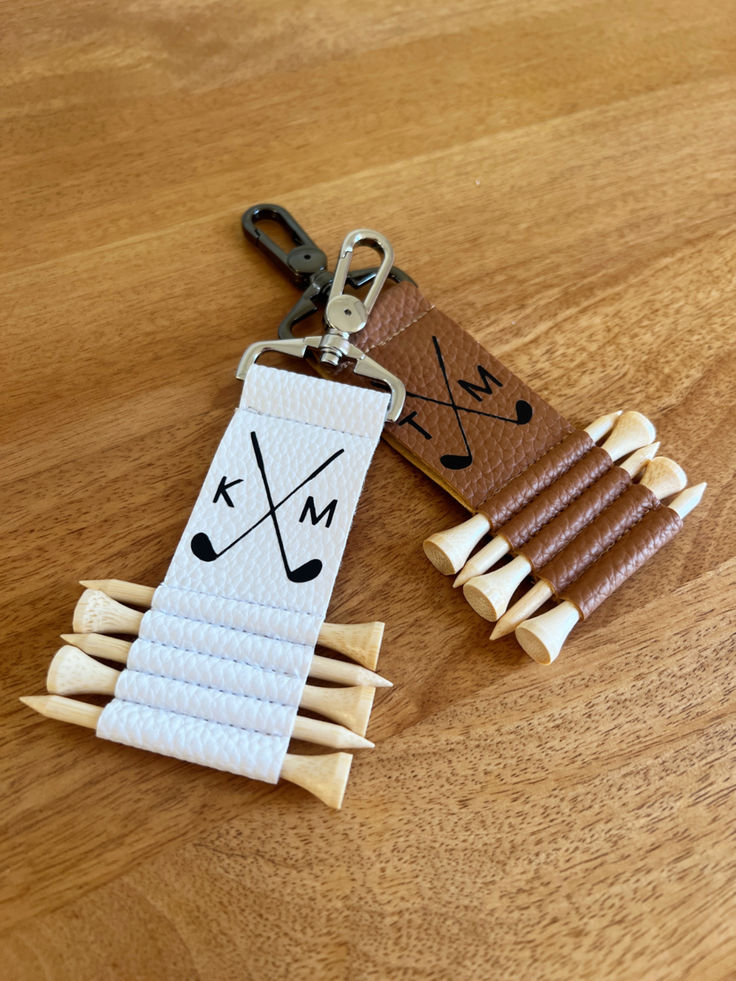 a keychain made out of wood sticks with a name tag attached to it