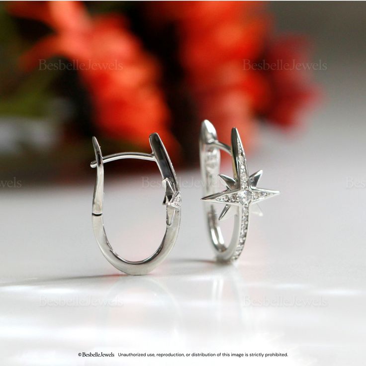 Metal: 925 Sterling Silver Stone: Brilliant cut, Pave brilliant set Stone weight: 0.03 ct (2.0mm) (piece) Total stones weight: 0.14 cttw (piece) Total stones weight: 0.28 cttw (pair) Overall Dimensions: 22mm x 13mm Silver Diamond Hoop Earrings With Single Diamond, Silver Hoop Earrings With Single Diamond As Gift, Anniversary Sterling Silver Hoop Earrings With Single Diamond, Silver Star-shaped Jewelry With Single Cut Diamonds, Silver Diamond Huggie Jewelry, Sterling Silver Huggie Diamond Earrings With Accents, Silver Hoop Earrings With Single Diamond, Sterling Silver Star-shaped Diamond Earrings, Elegant Star-shaped Sterling Silver Diamond Earrings